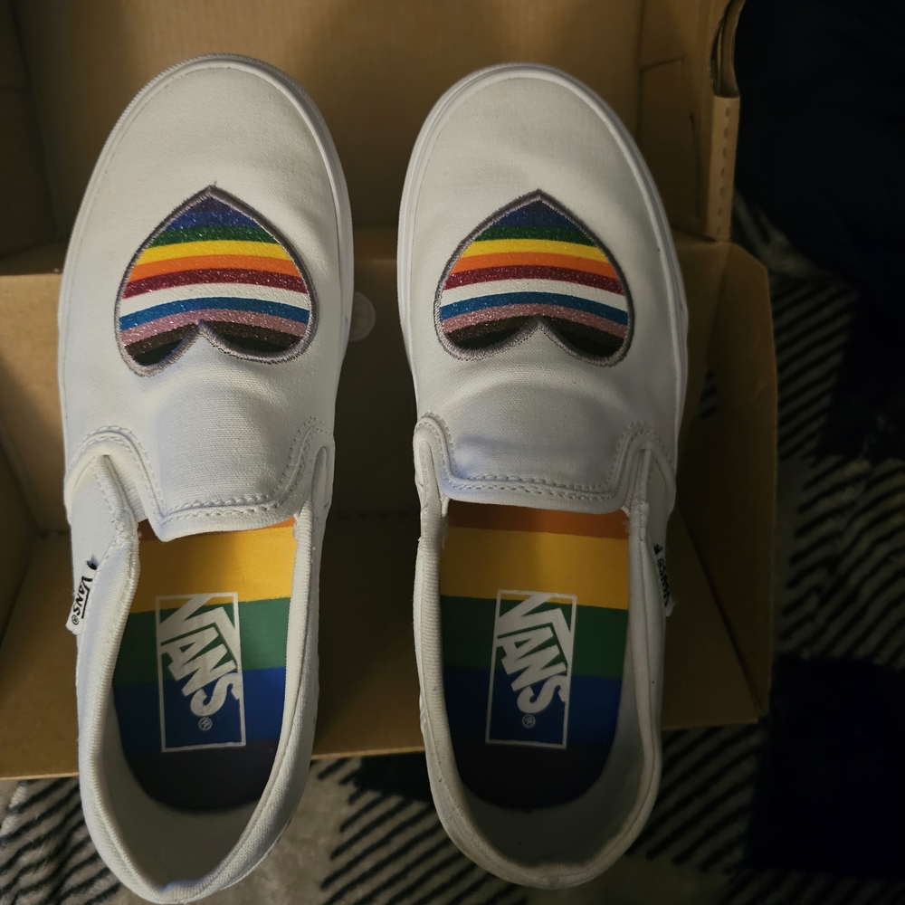 Vans White Slip-On Sneakers with Rainbow Heart Patches